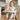 a baby sitting in a highchair with a toy duck