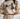 a woman wearing a sweater with a duck on it