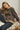 a woman sitting on a bed