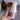 a hand holding a bottle of baby wash