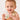 a baby holding a toy