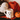a white mug with a face and a pumpkin next to a red blanket