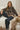 a woman sitting on a couch
