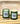 a couple of green candles on a wooden surface