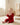a baby sitting on the floor holding a toy