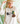 a woman wearing a hat and a sweater with a duck on it