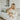 a woman holding a baby in a kitchen
