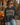 a woman wearing sunglasses and a sweatshirt