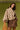 a woman in a brown shirt