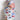 a baby wrapped in a blanket with cars on it