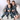 a group of boys sitting on a chair