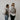 two women with backpacks looking back