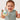 a baby holding a toy